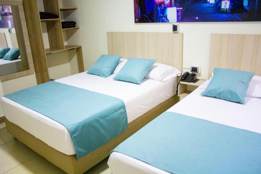 Postel nebo postele na pokoji v ubytování Hotel Boutique Street 50