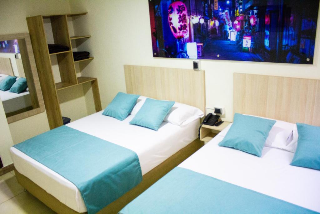 Postel nebo postele na pokoji v ubytování Hotel Boutique Street 50