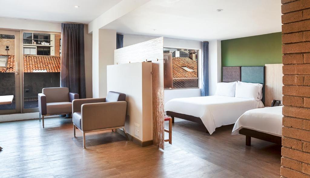 Postel nebo postele na pokoji v ubytování Hotel Viaggio Teleport City Suites