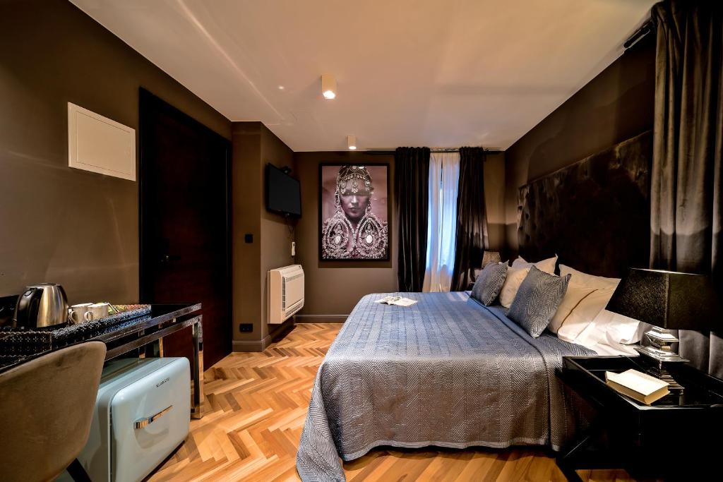 Postel nebo postele na pokoji v ubytování ARTALE 07 Design Rooms