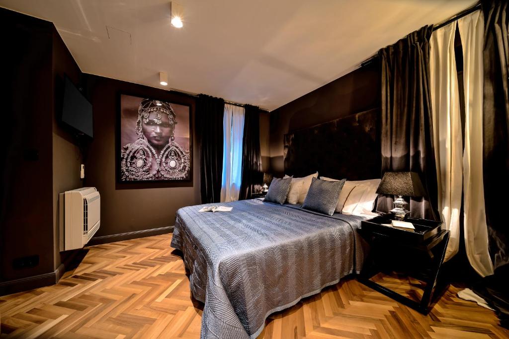 Postel nebo postele na pokoji v ubytování ARTALE 07 Design Rooms