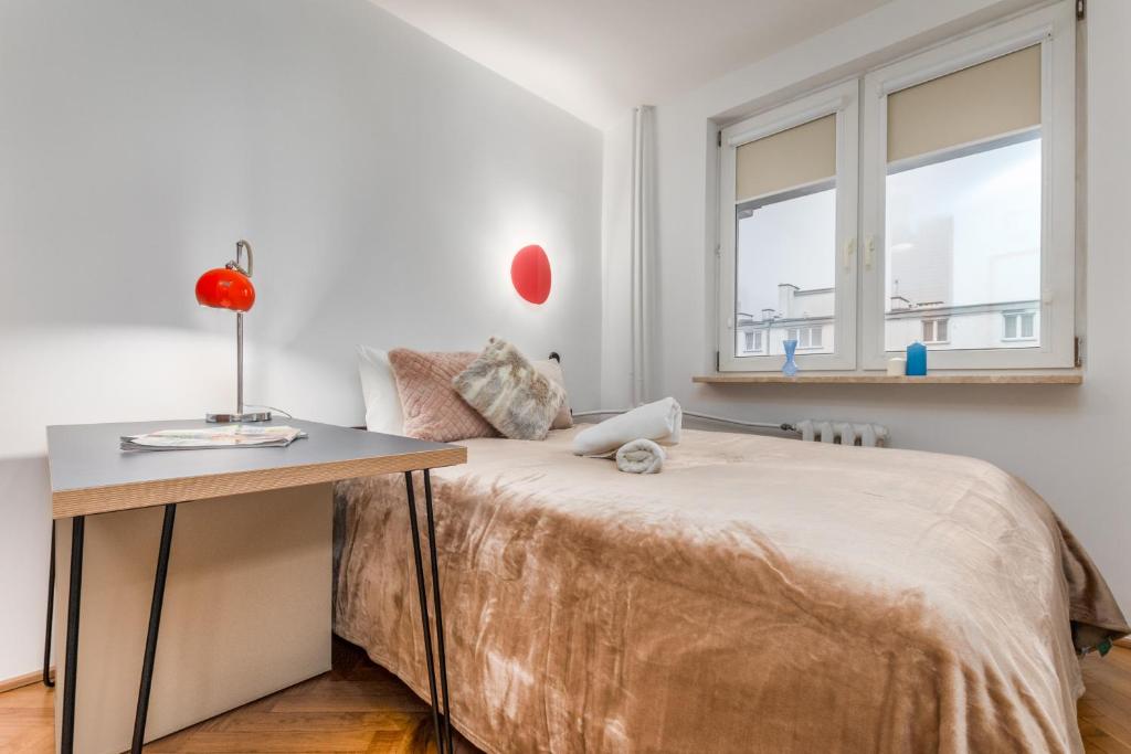 Postel nebo postele na pokoji v ubytování Apartments City Center Warsaw by Noclegi Renters