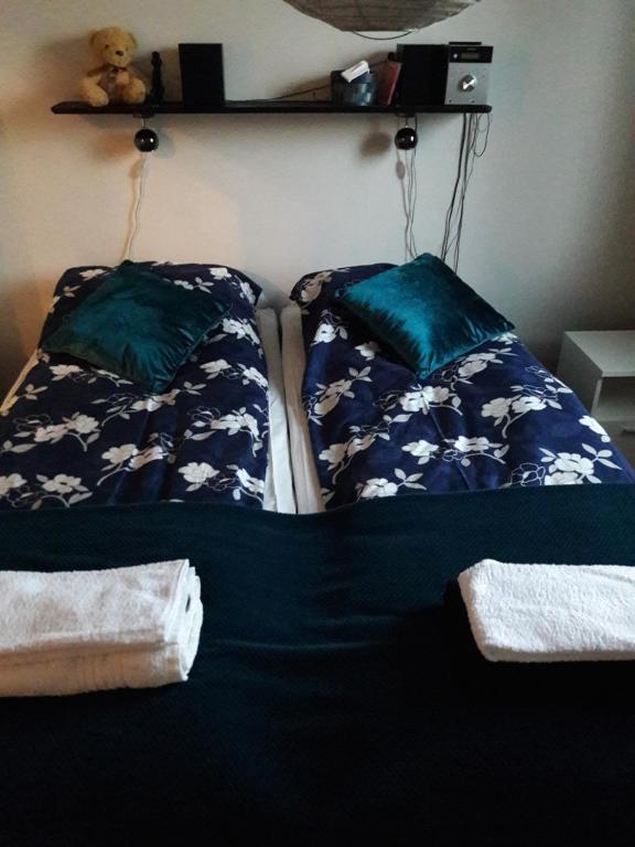 a bedroom with two beds with pillows on them at Apartment Kivistö, 2 km from centrum, free wifi and parking, no smoking, non-allergenic in Jyväskylä