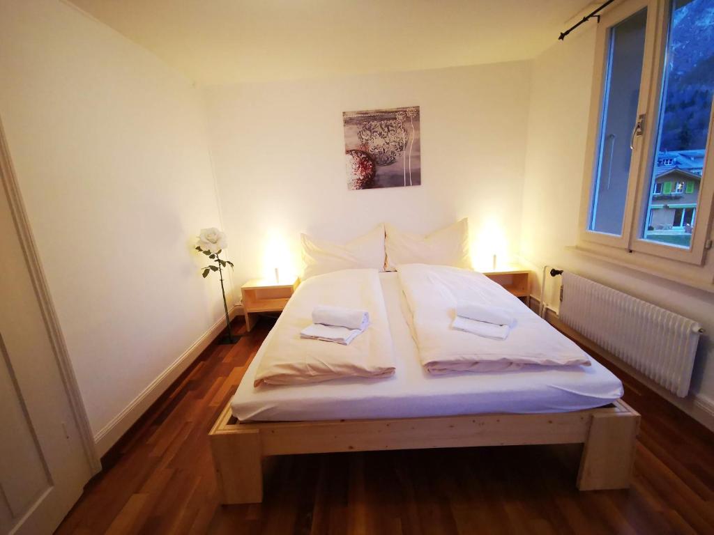 Postel nebo postele na pokoji v ubytování Downtown Apartments