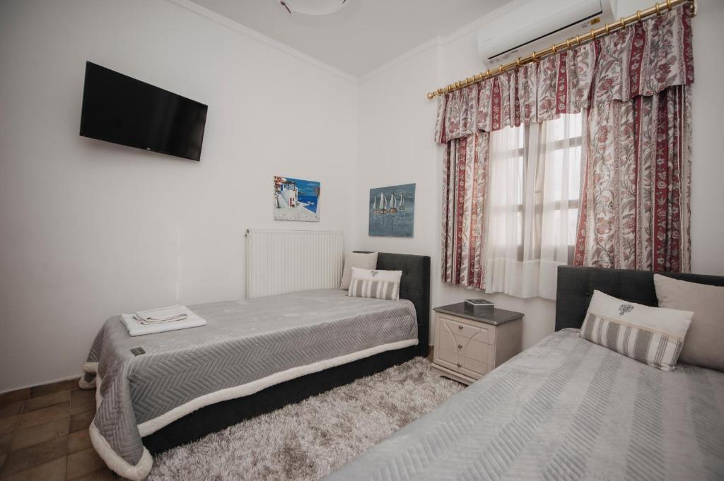 Postel nebo postele na pokoji v ubytování Mythic House