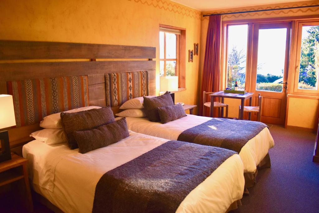 Uma cama ou camas num quarto em Hotel & Apart Hotel Monte Verde