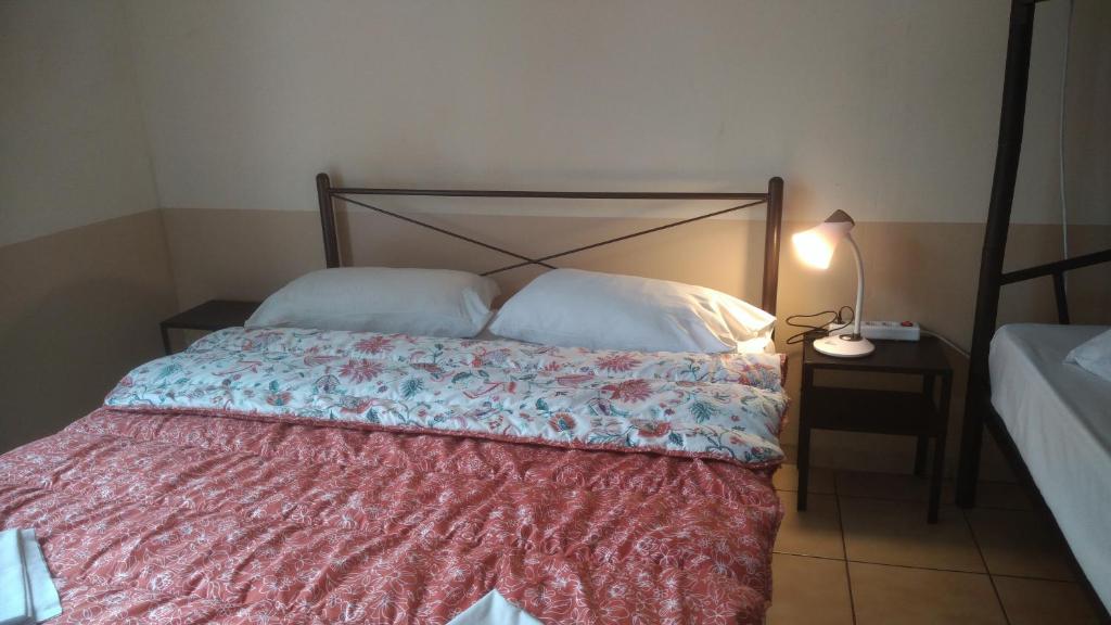 Postel nebo postele na pokoji v ubytování SAN REMO HOSTEL