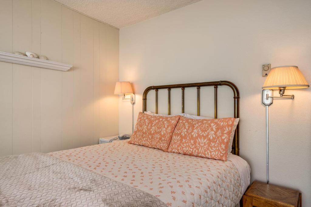 Postel nebo postele na pokoji v ubytování Pacific Sands Resort