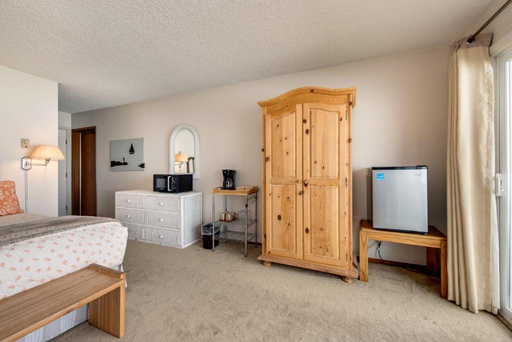 Postel nebo postele na pokoji v ubytování Pacific Sands Resort