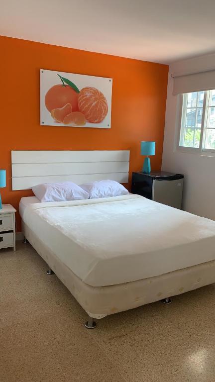 Postel nebo postele na pokoji v ubytování Hostal Familiar Carmencita