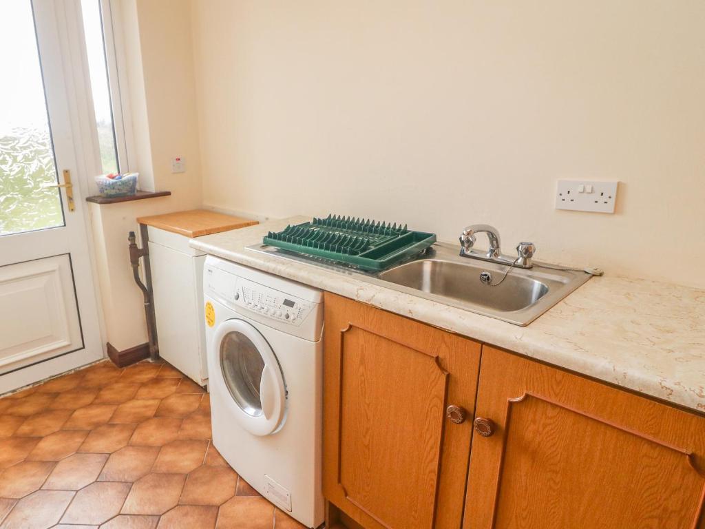 Kuchyň nebo kuchyňský kout v ubytování Cleary Cottage
