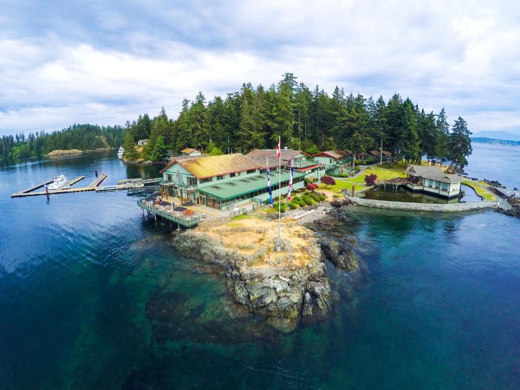 an aerial view of a house on an island in the water at April Point Resort in Quathiaski Cove