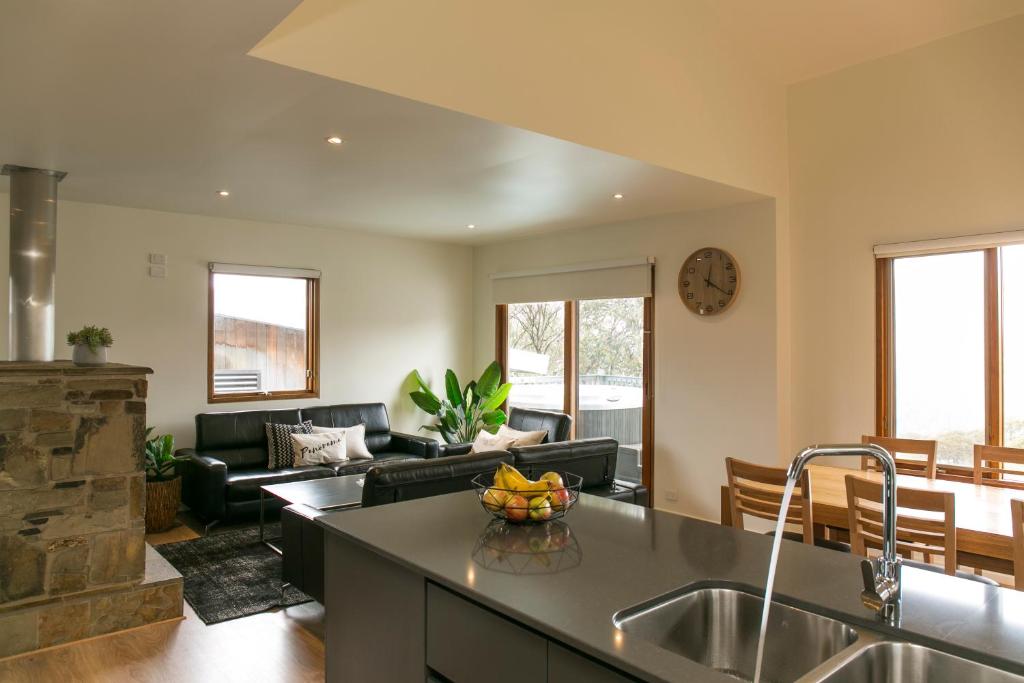 a kitchen and living room with a sink and a counter at Frueauf Village in Falls Creek