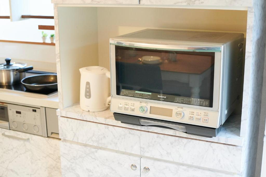 Kuchyň nebo kuchyňský kout v ubytování Awaji Portside Holiday Home CHOUTA - BBQ OK! - Self Check-In Only