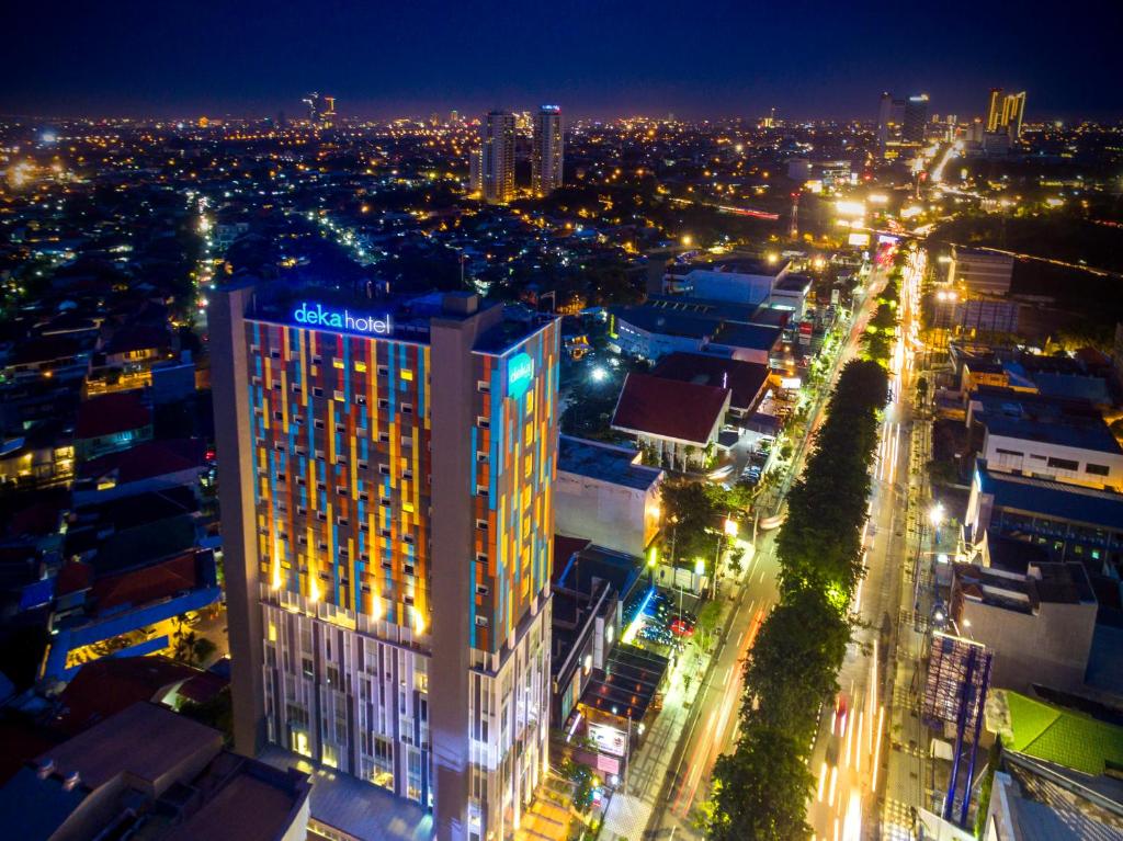 a view of a city at night with lights at Deka Hotel Surabaya HR Muhammad in Surabaya