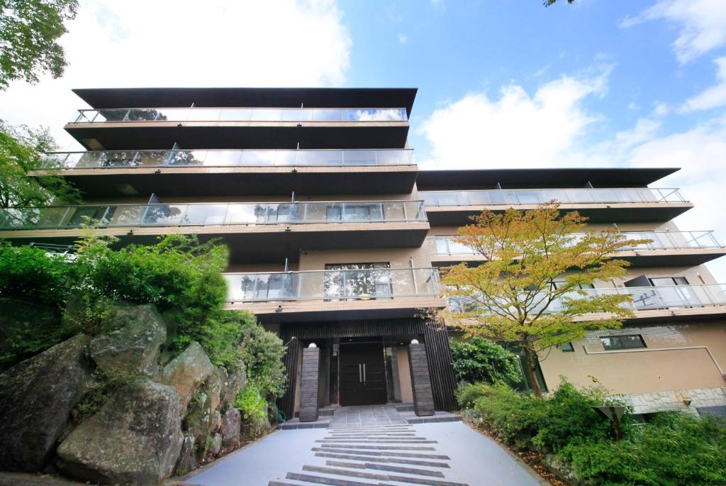 a building with a walkway in front of it at Yutorelo-an ANNEX in Hakone