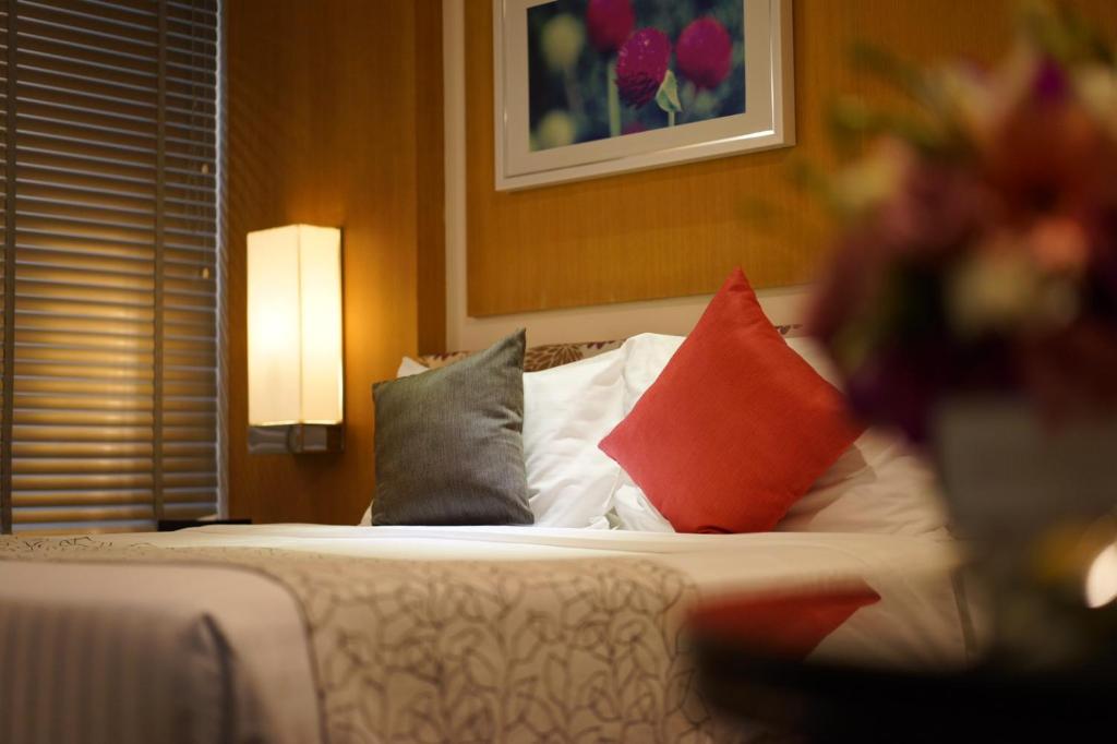 Postel nebo postele na pokoji v ubytování Amaranth Suvarnabhumi Hotel - Free Suvarnabhumi Airport Shuttle
