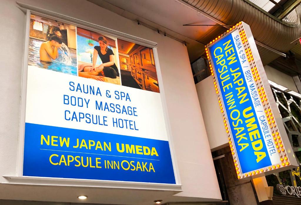 a sign for a new japan universal capsule hotel at Capsule Inn Osaka (Male Only) in Osaka