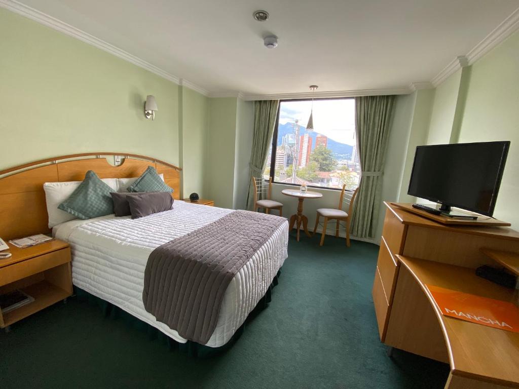 Postel nebo postele na pokoji v ubytování Hostal de La Mancha