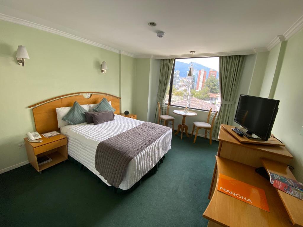 Postel nebo postele na pokoji v ubytování Hostal de La Mancha