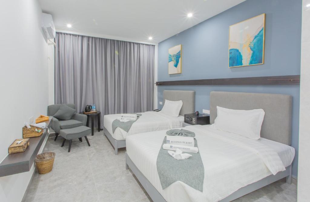Postel nebo postele na pokoji v ubytování Bohol Panglao Begonia Resort