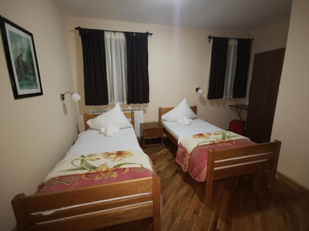 Postel nebo postele na pokoji v ubytování Hotel Gacka