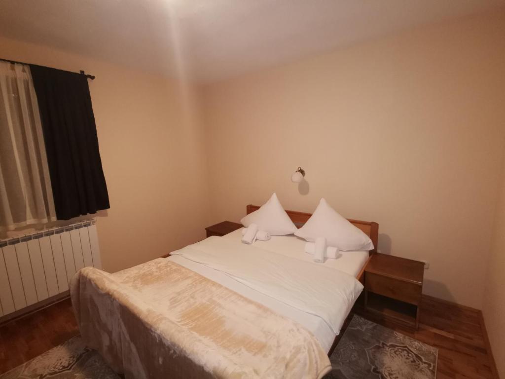 Postel nebo postele na pokoji v ubytování Hotel Gacka