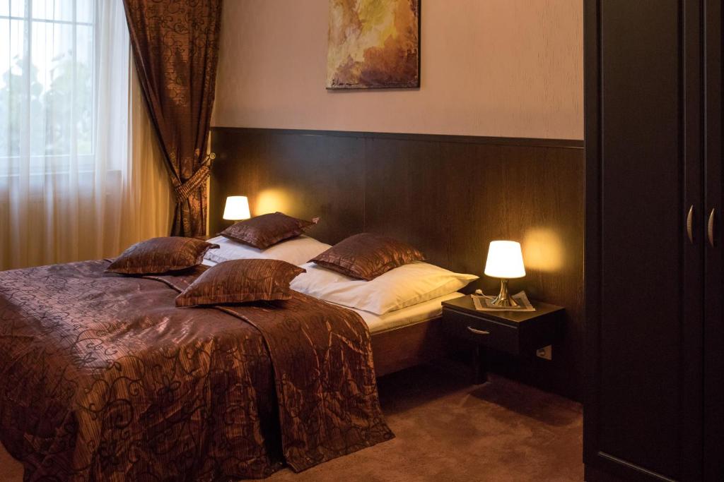 Postel nebo postele na pokoji v ubytování Hotel Slovan