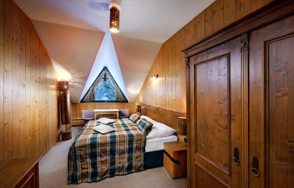Postel nebo postele na pokoji v ubytování Hotel Tri Studničky - Adult friendly