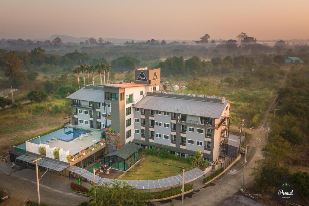 an aerial view of a building with a swimming pool at Proud Khaoyai in Pak Chong