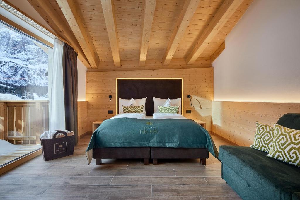 Postel nebo postele na pokoji v ubytování Hotel Tabladel