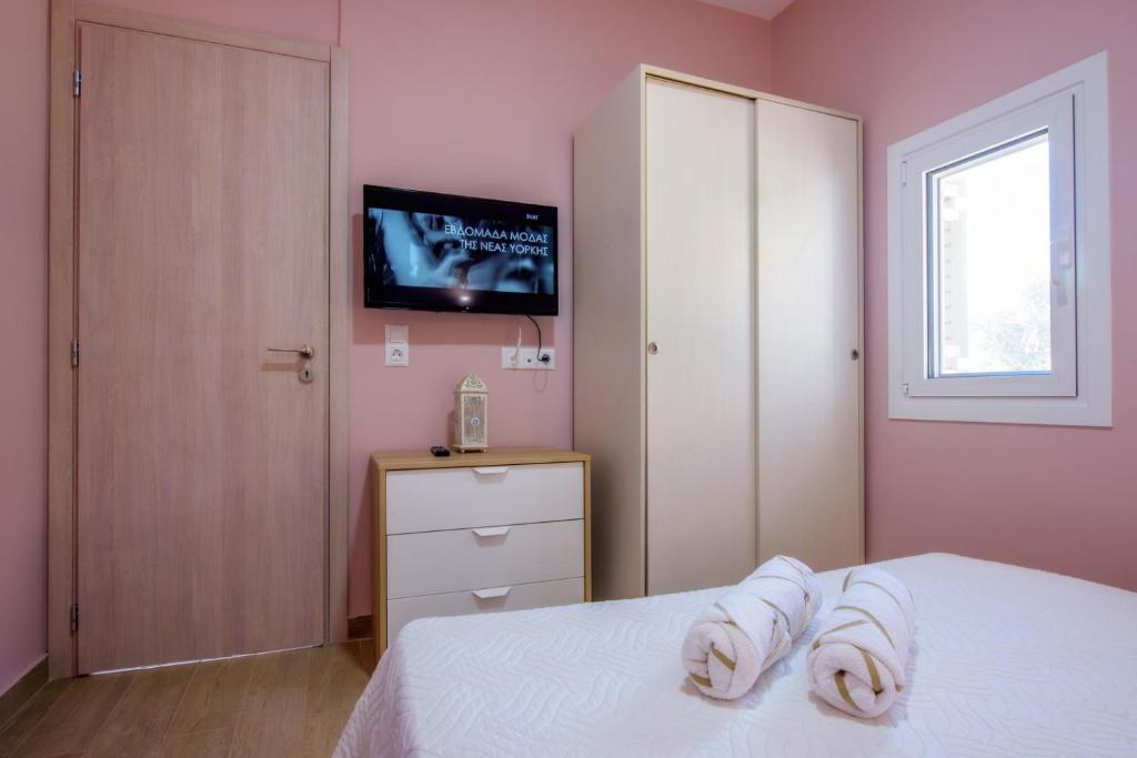 Postel nebo postele na pokoji v ubytování Gouves Garden Hersonisos Heraklion
