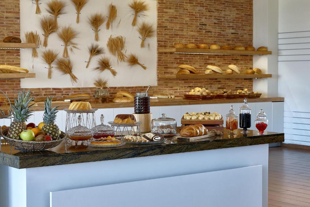 a buffet with a variety of bread and pastries at Vasia Resort & Spa in Sisi