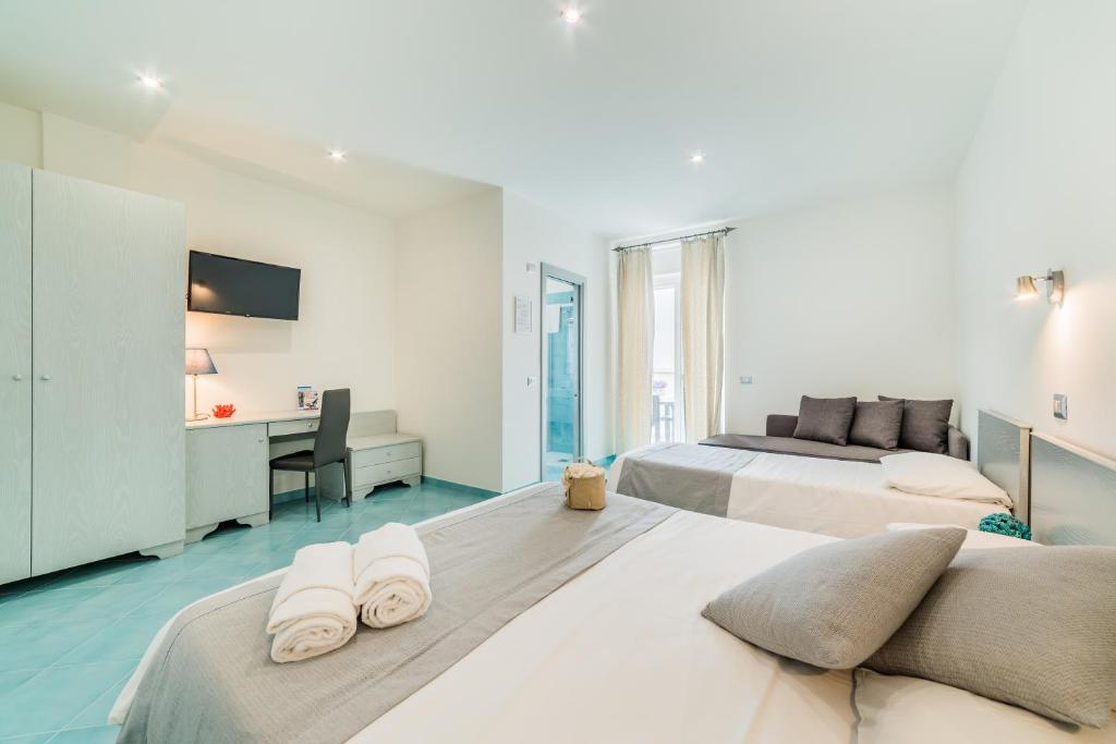 Postel nebo postele na pokoji v ubytování Hotel Corallo Circeo