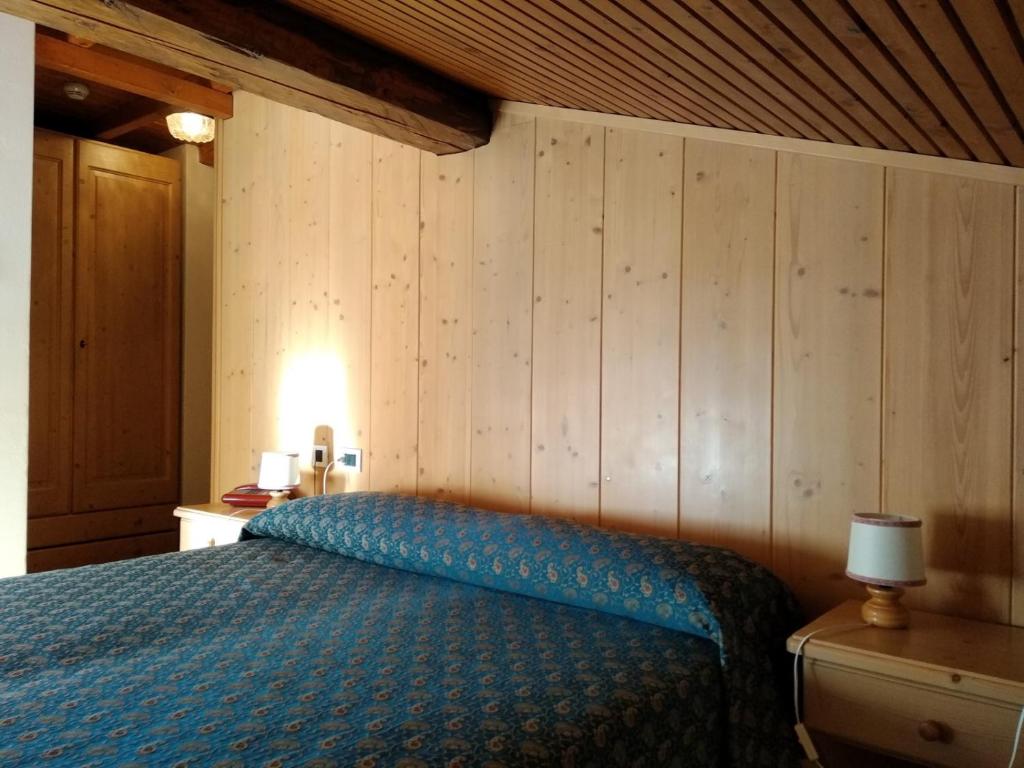 Postel nebo postele na pokoji v ubytování Hotel Garnì Miramonti