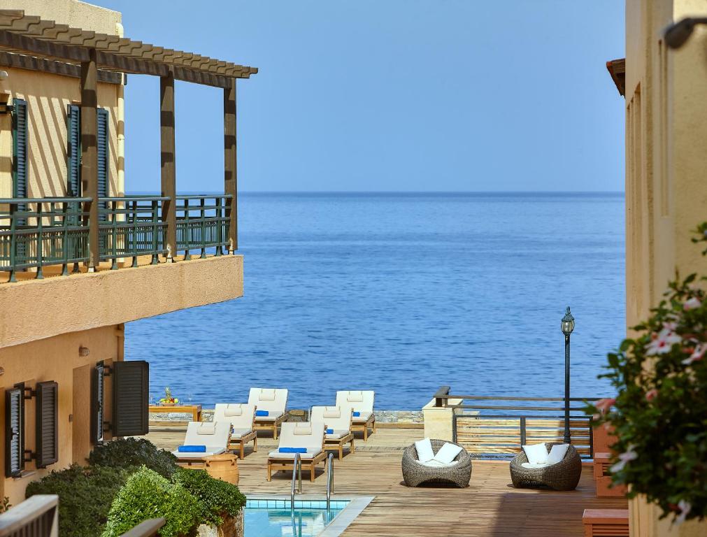 a view of the ocean from the balcony of a hotel at Vasia Resort & Spa in Sisi