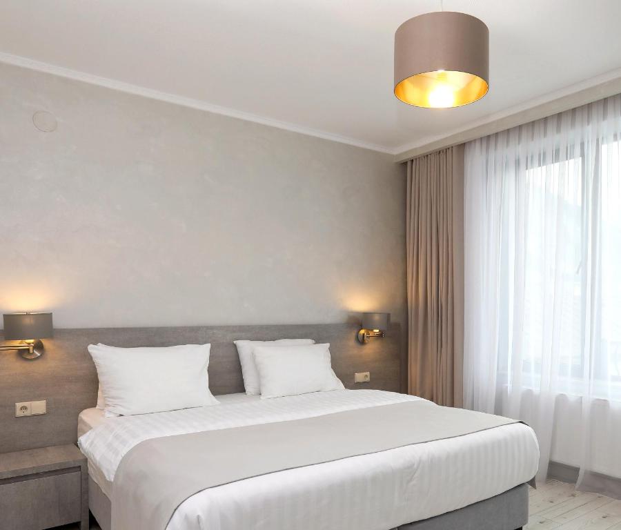 Postel nebo postele na pokoji v ubytování Sunset Terrace Mestia