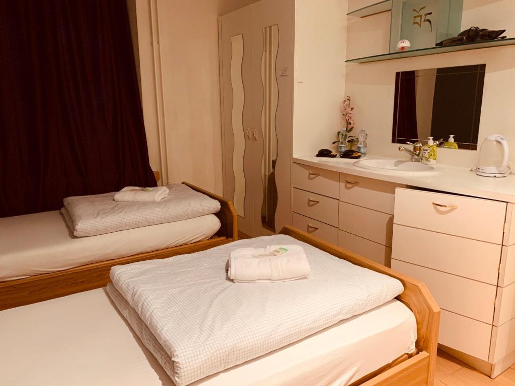 Letto o letti in una camera di Swiss Dewa