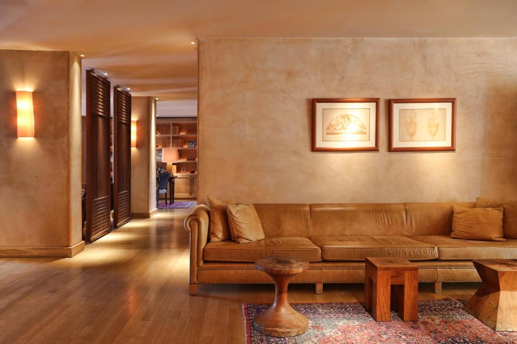 a living room with a couch and a table at The Margi in Athens