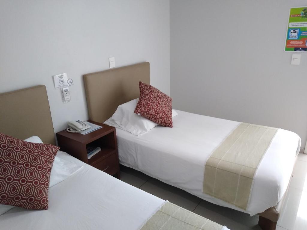 Postel nebo postele na pokoji v ubytování Suites Chapultepec