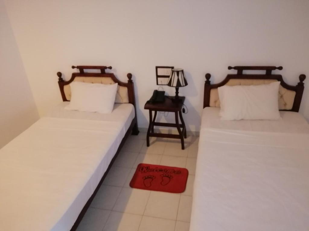 Postel nebo postele na pokoji v ubytování Centauria City Hotel