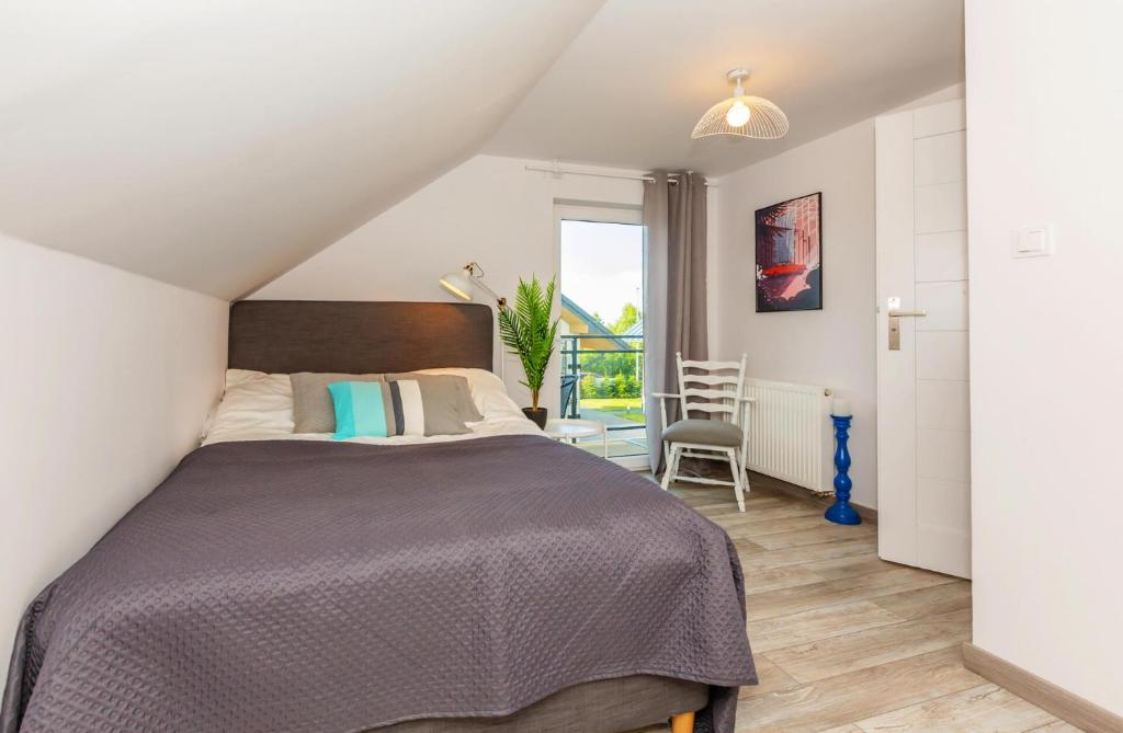 Posteľ alebo postele v izbe v ubytovaní Apartamenty.in Jastrzębia Góra