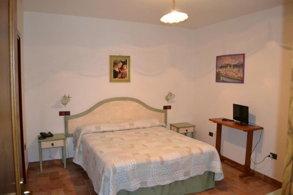 Postel nebo postele na pokoji v ubytování Albergo Fontanelle