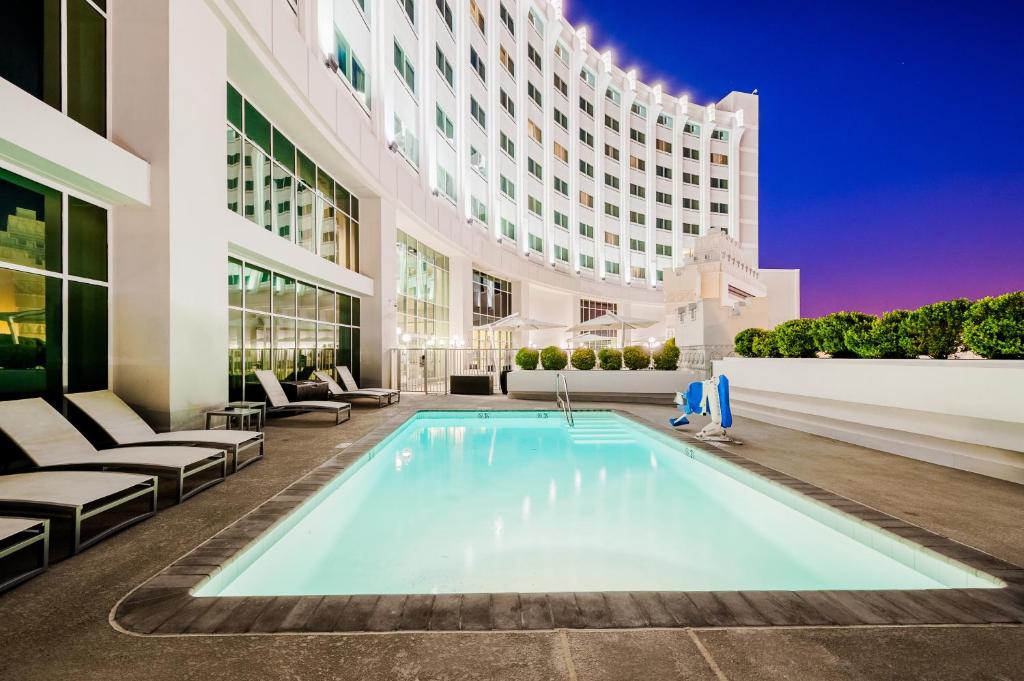 a swimming pool in a building with a hotel at The Commerce Casino & Hotel in Commerce