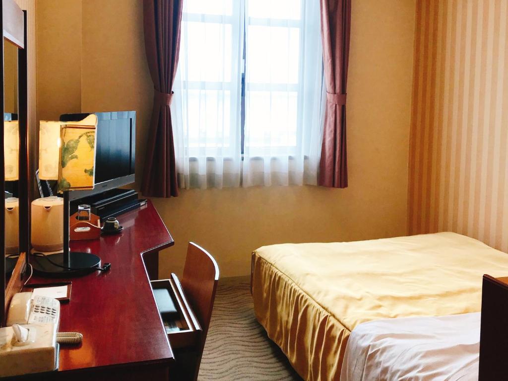TV a/nebo společenská místnost v ubytování Kitabiwako Hotel Grazie