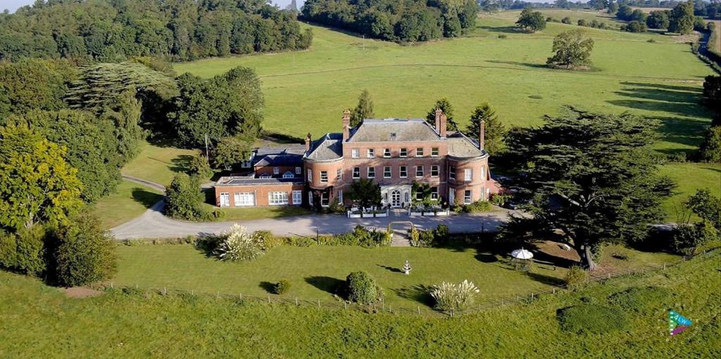 an aerial view of a large house in a field at Longworth Hall Hotel in Hereford