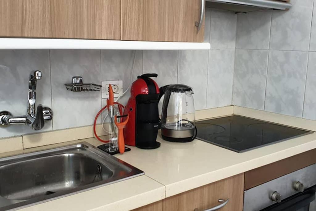 a kitchen counter top with a sink and a counter top at Copacabana 2 in Playa Fañabe