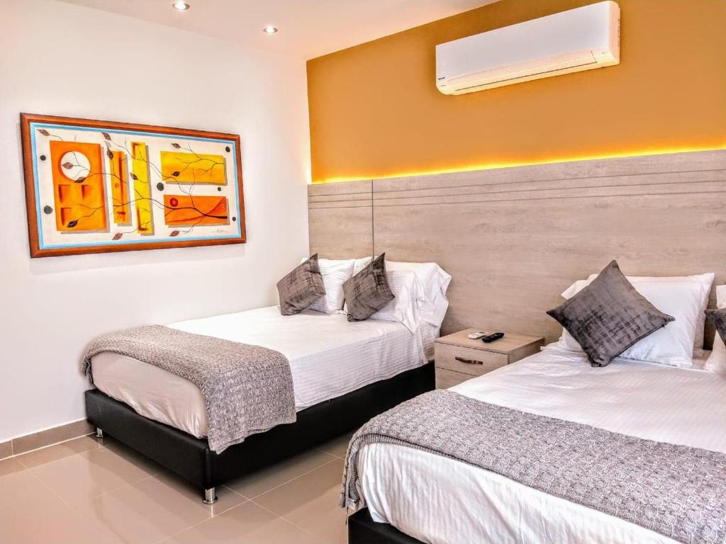 Cama o camas de una habitación en Hotel Súper Estrellas