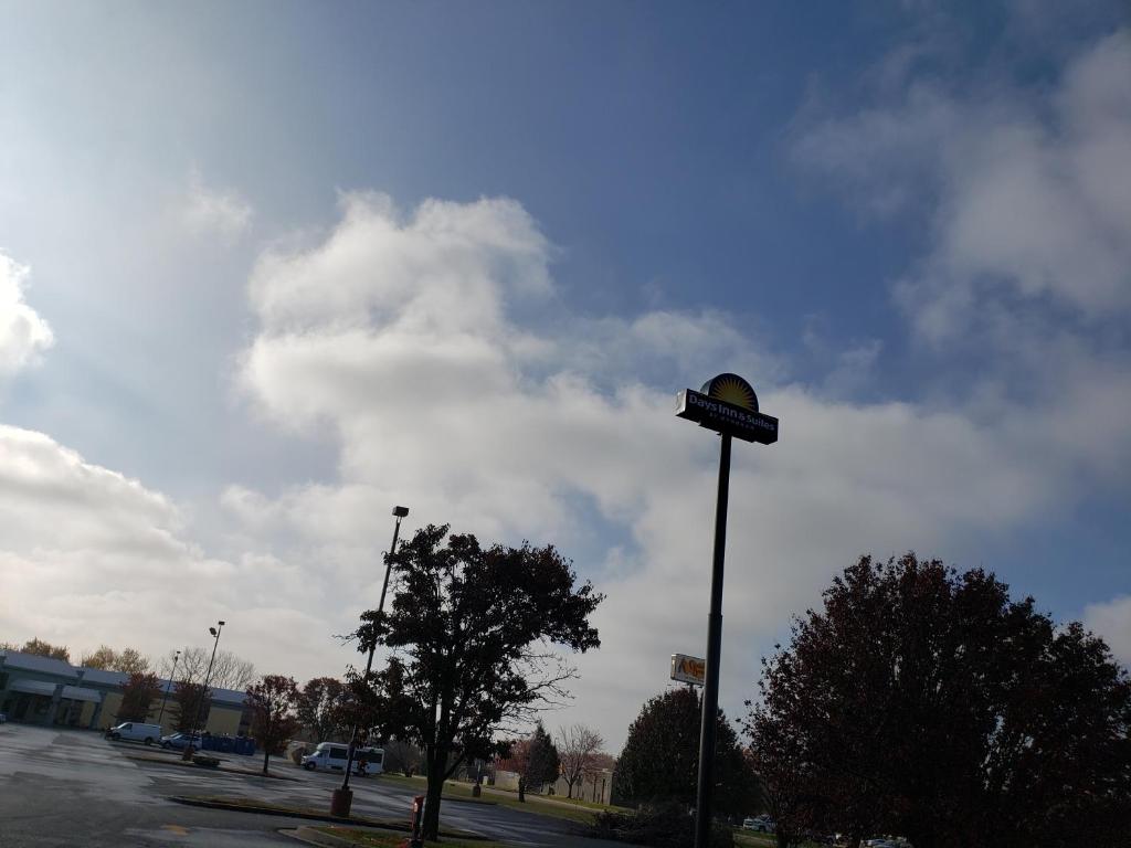 a street light on a pole in a parking lot at Days Inn & Suites by Wyndham Merrillville in Merrillville