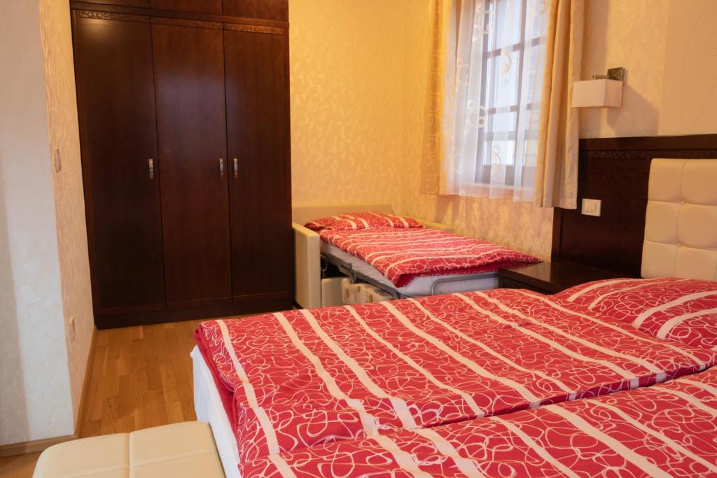 Postel nebo postele na pokoji v ubytování Vila Silva Marija Apartments